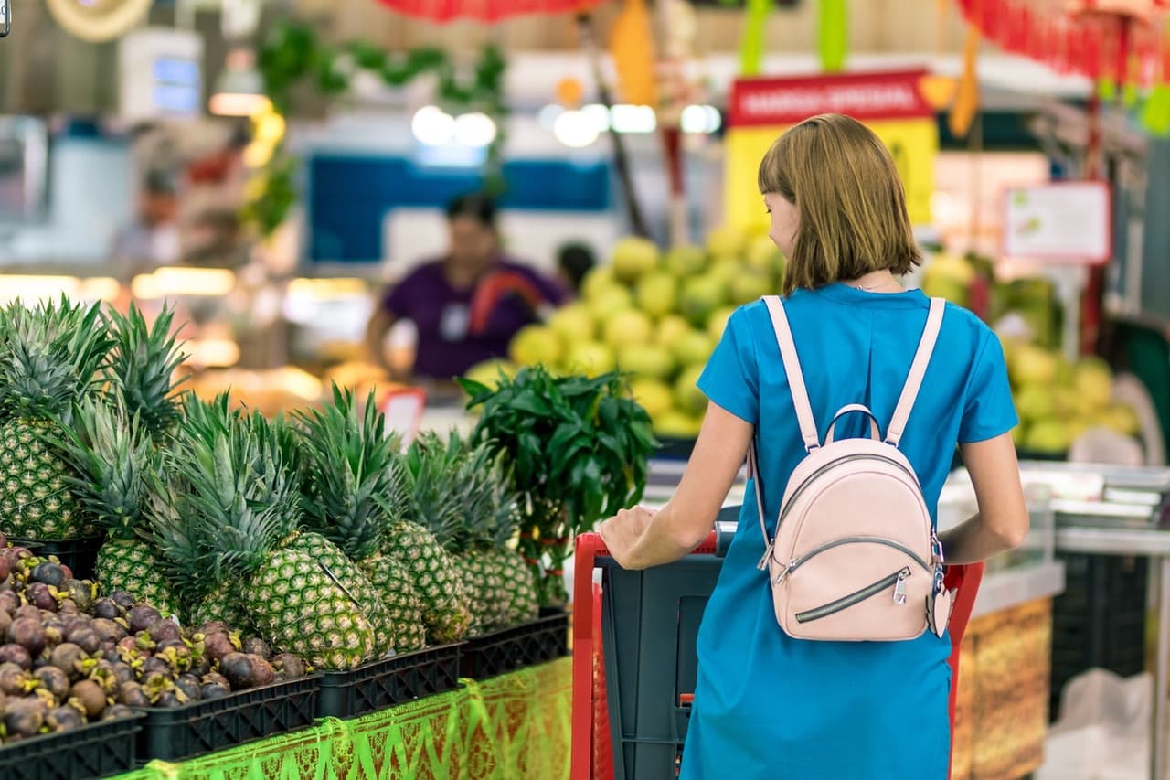 Cover of Shopping missions with a woman puchasing some food