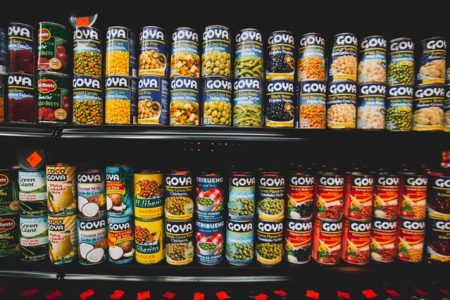 Cans on a shelf sorted by category managers